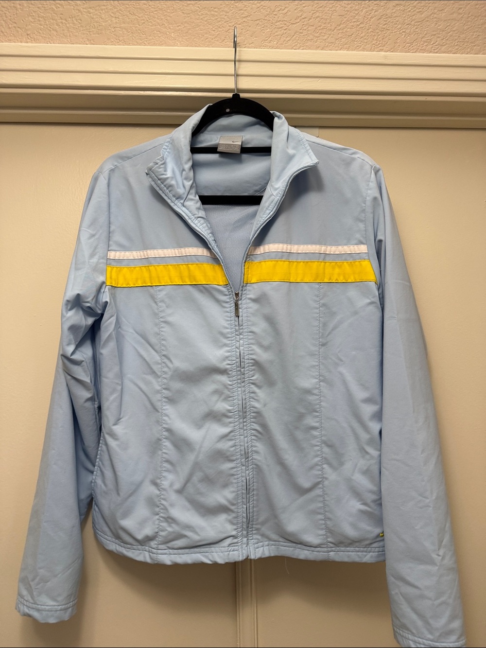 Vintage Nike Light Blue Windbreaker Jacket with Yellow Chest Stripe. Size L
